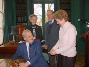 Signing a book for President Hilary King JP after speaking to the ESU in Liverpool in April 2008. Behind are the author's brother and sister-in-law, Gerald and Judith Henderson.