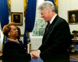 Rev Dr Paige Chargois presents to President Bill Clinton a copy of ‘Forgiveness: Breaking the Chain of Hate’