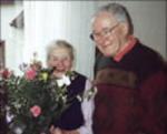 Tom Tate with Emilie Bohnenberger who, 52 years before, had given him her late husband's boots for his journey to prison camp 